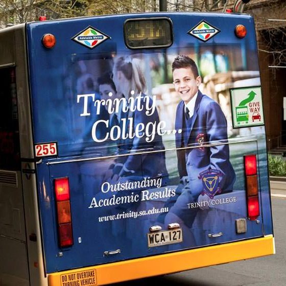Trinity College bus back advertising.